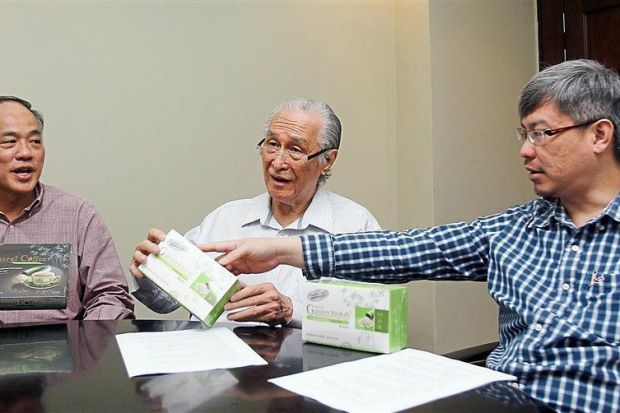 Long legacy: (From left) Hew, Kai Hee and Keng Kang showing Hai-O’s bestselling products.
